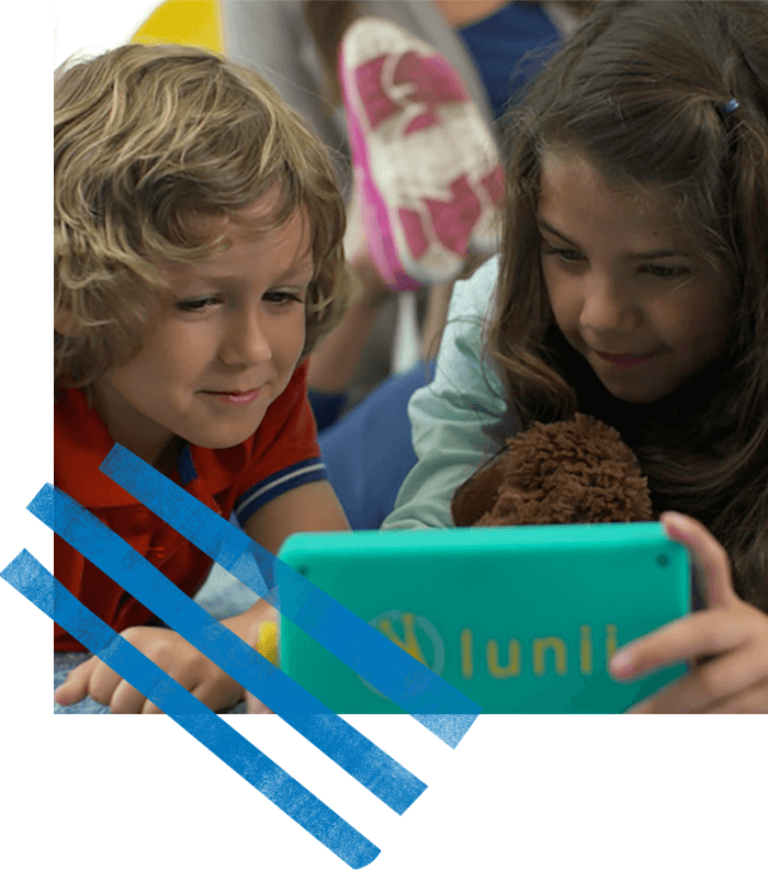 Two children playing with technology product