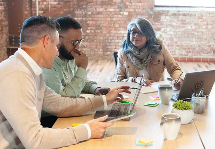 Sales representative consulting a group of people