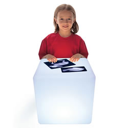 3 years & up. This rugged light cube is portable, durable, and rechargeable. It even strobes, flashes, and changes color with the touch of a button! The cube is the perfect size for individual and small group play. Young children can stand or kneel at the cube and engage in focused, quiet play. The easy-to-clean surface is ideal for art and exploration activities both indoors and outdoors. Use the cube for examining transparent and opaque objects. Add interest to counting, sorting, sequencing, and building activities. Includes: cube, power source, remote control, and a teacher guide. Measures: 16"H x 16"W x 16"D.