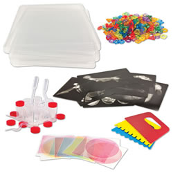 3 years & up. This Light Cube Accessory Kit is the perfect light table starter kit for younger students! The kit features tons of safe and colorful materials to play with on the Light Cube (sold separately #27915). Count and sort beautiful bead shapes, examine details in x-rays, layer Optical Illusion sheets to discover interesting patterns, drop paint onto the washable surface, and drag paint scrapers on top to make swirls and lines. Includes: 5 clear plastic trays that fit snugly on the Light Cube, Counting and Stringing Rings, 12 Optical Illusion sheets, 2 Paint Pipettes, 2 Sqiggle Pipettes, 8 clear vials, 3 Paint Scrappers, 8 Animal X-Rays, and a teacher guide.