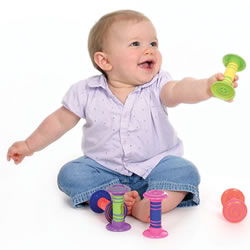 baby playing with rattle