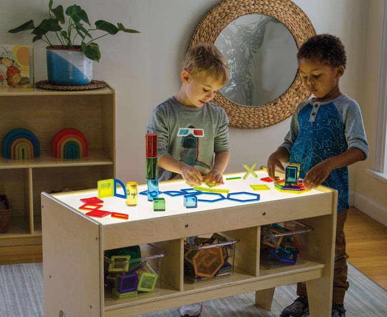 Children playing with light box