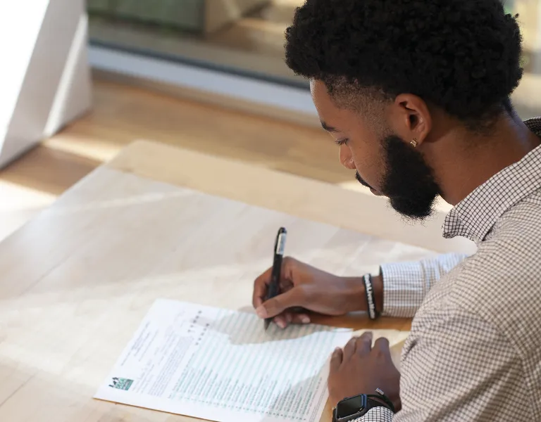 Teacher filling out the DECA for Preschoolers assessment