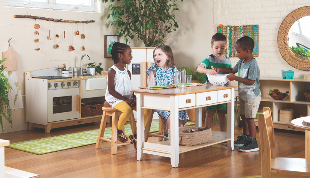 Children laughing and playing around the Sense of Place Kitchen Island