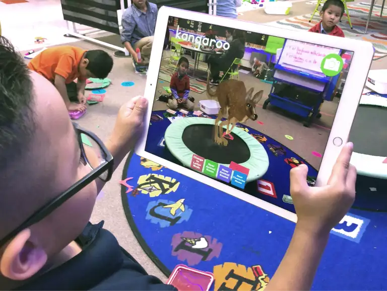 Child using Alive Studios app on a tablet