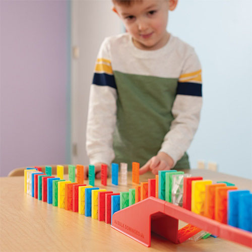 Child Playing with Domino Blocks