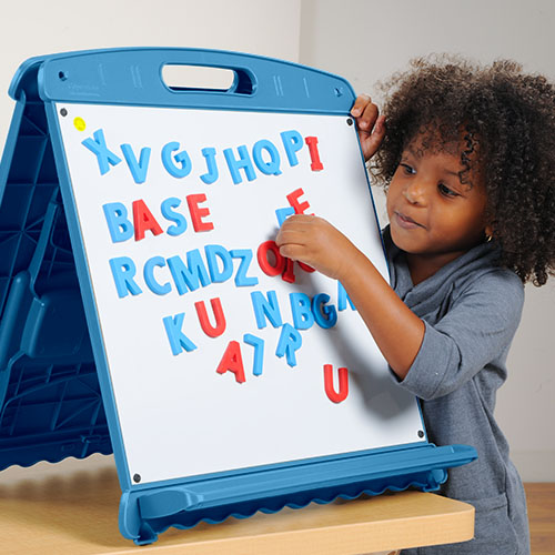 Child Playing with Magnetic Board