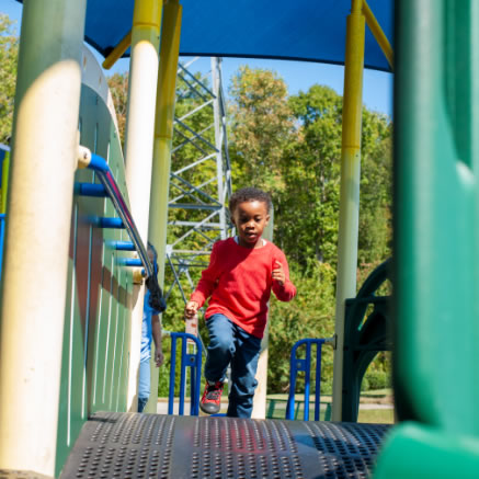 Child Running Through Jungle Gym