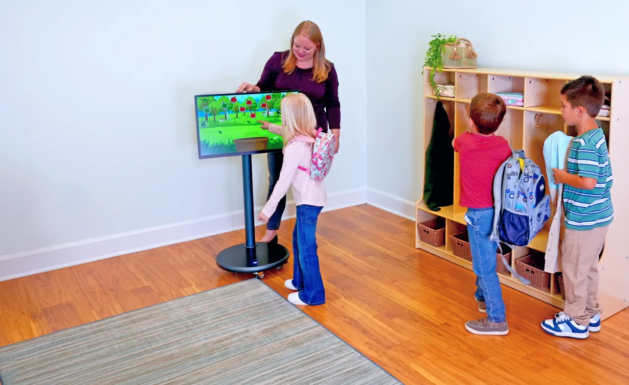 Teacher with children using the Muv Pro