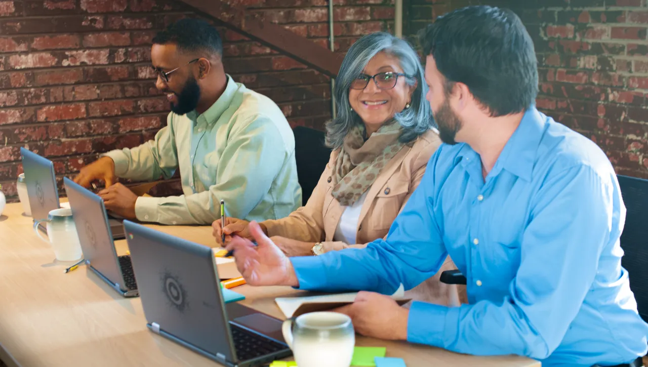 Woman participating in a virtual training session on a laptop