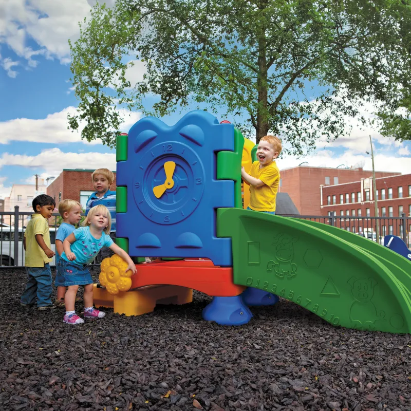 Toddler playground structure with children playing on it