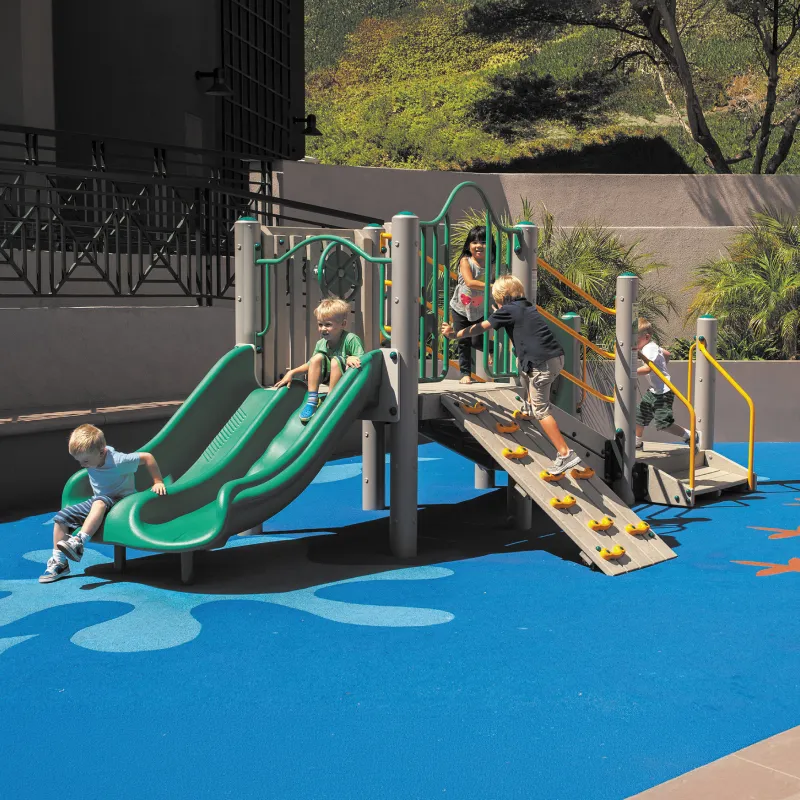 Small playground structure with young children playing on it