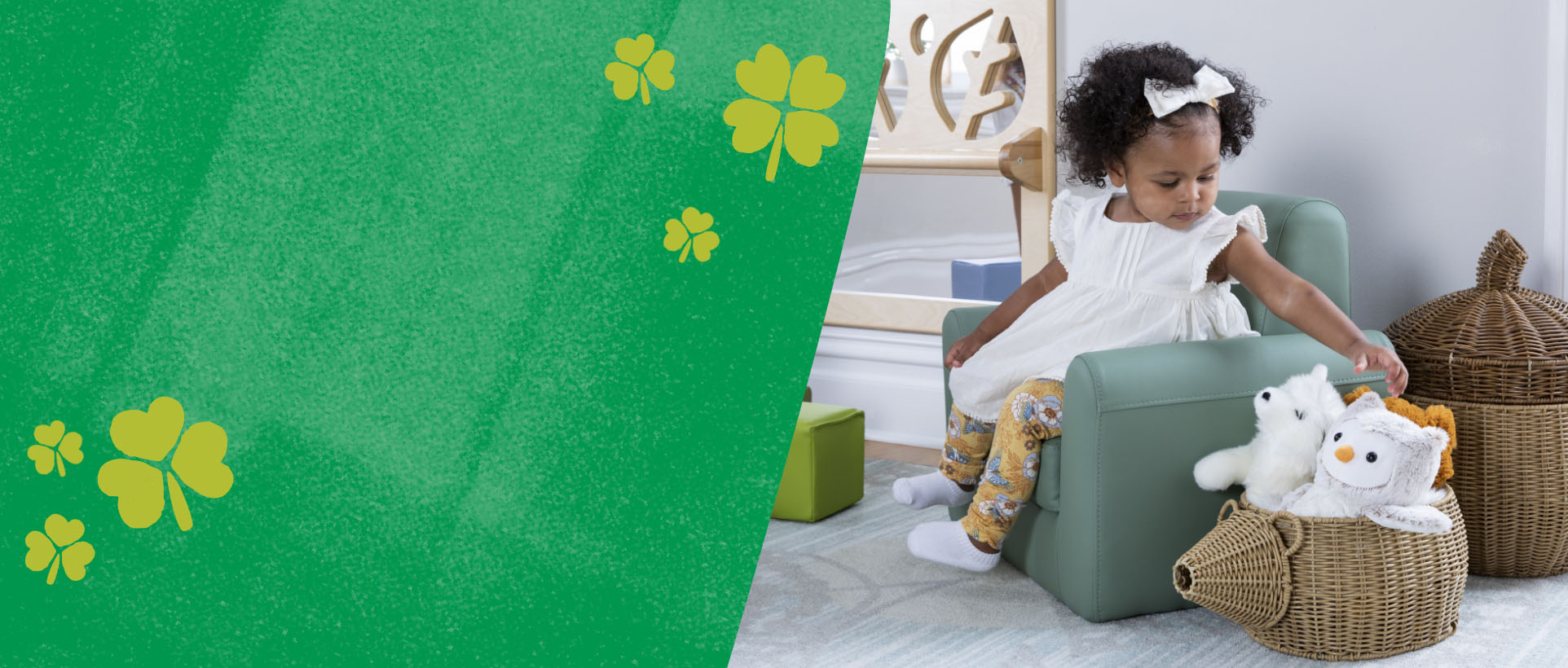 Girl sitting in a chair reaching for stuffed animals