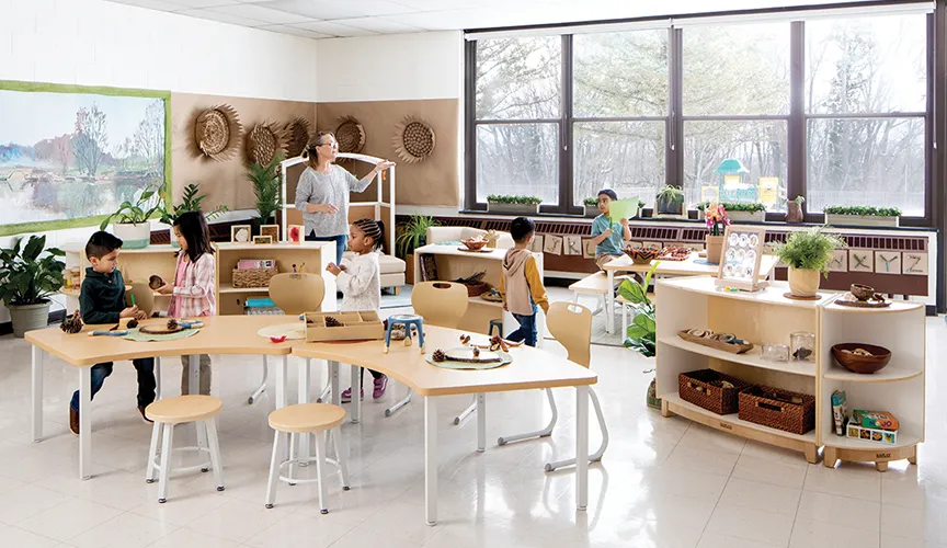 Techer and students inside a kindergarten classroom furnished with Sense of Place Elementary furniture