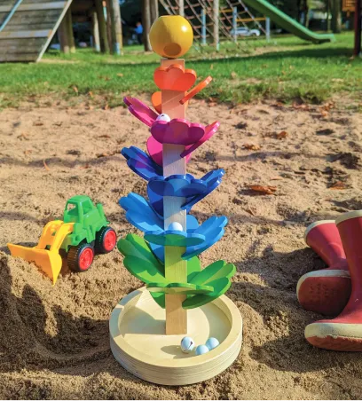 Melody Marble Tree standing in a sandbox