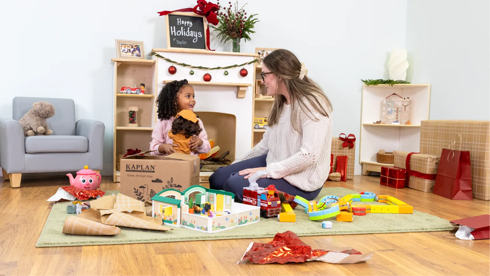 Child and parent opening gifts of toys