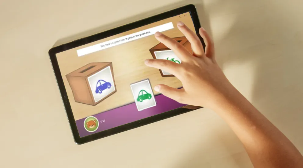 Child's hand using EFgo software on a tablet