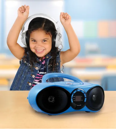 Girl wearing headphones with a boombox