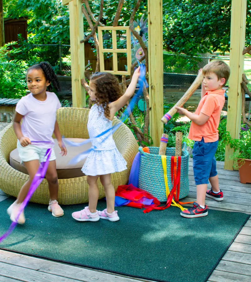 Children playing with colored streamers
