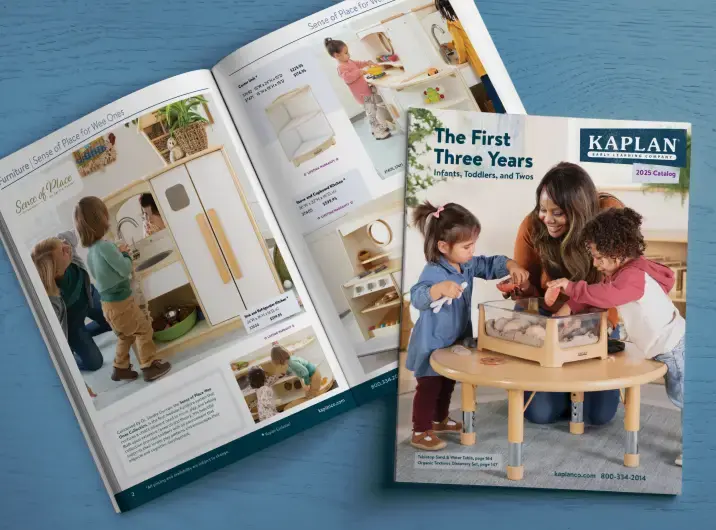 Image of a Kaplan catalog open to a spread of preschool furniture with the cover for the Kaplan Infants, Toddlers, and Twos catalog to the side