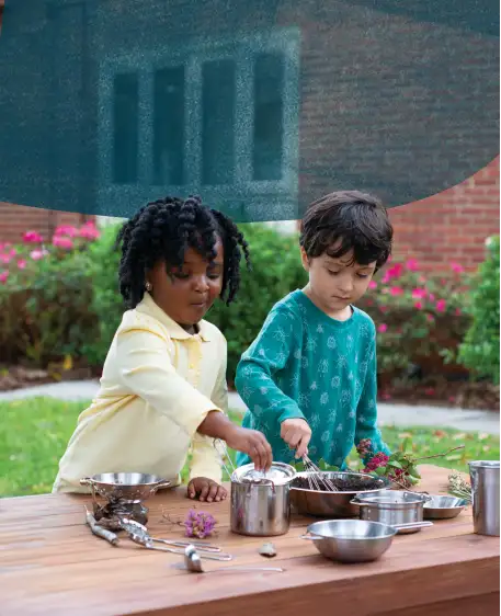 Children playing with stainless steel kitchen set